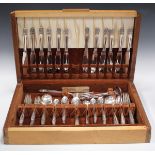 A Holmes & Edwards canteen of plated cutlery, in the style of Georg Jensen, boxed (one serving knife