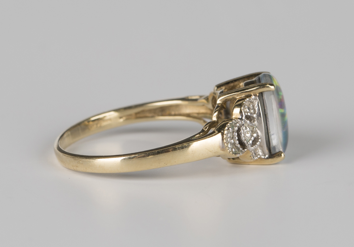 A 9ct gold ring, claw set with an oval opal triplet between diamond set pierced shoulders, - Image 2 of 6