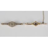 A gold bar brooch, collet set with a circular cut amethyst between two seed pearls, detailed '