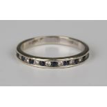 A 9ct white gold, sapphire and diamond half eternity ring, mounted with alternating circular cut