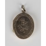 A Victorian gold back and front oval pendant locket with engraved decoration, length 3.2cm.Buyer’s