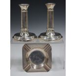 A pair of Elizabeth II silver candlesticks with cylindrical columns and circular bases, Birmingham