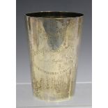 A late Victorian silver beaker of tapered cylindrical form with engraved presentation inscription,