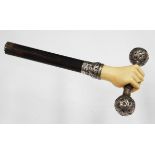 A late Victorian silver and ivory mounted parasol/cane handle, the terminal designed as a carved