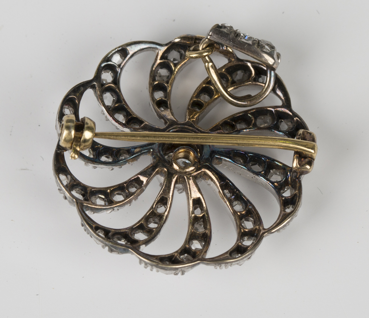 A Victorian gold backed and silver fronted diamond set pendant brooch in a spiral shaped circular - Image 2 of 2