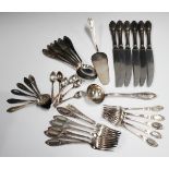 A collection of plated cutlery, including two Continental part canteens.Buyer’s Premium 29.4% (