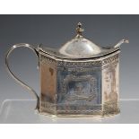 A Victorian silver mustard of cut cornered rectangular form with hinged lid, blue glass liner and