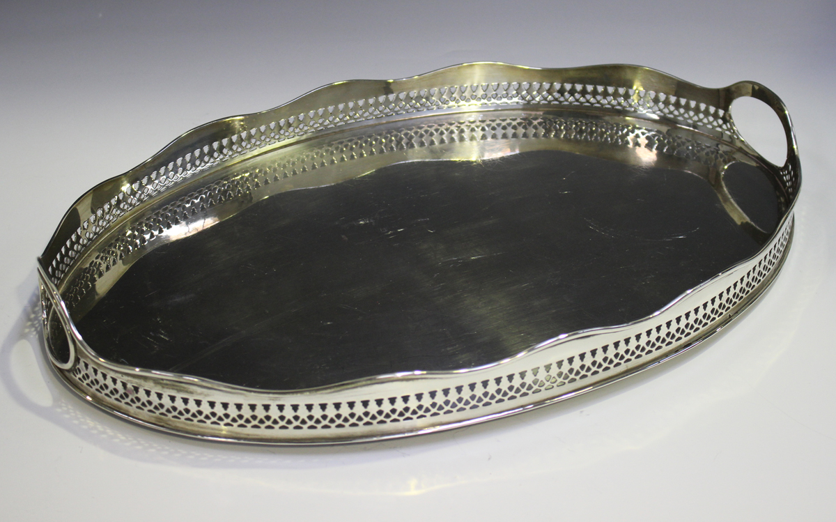 An Elizabeth II silver oval two-handled gallery tray with pierced decoration, London 1966 by William