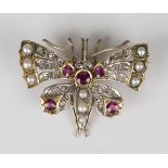 A gold, diamond, ruby and half-pearl brooch, designed as a butterfly with outspread wings, mounted
