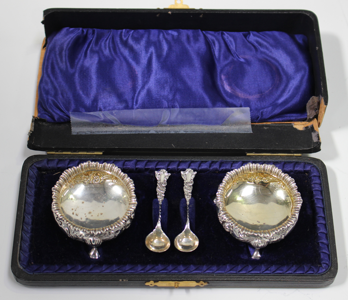 A pair of Edwardian silver circular salts with gadrooned rims and chased floral decoration, on - Image 2 of 3