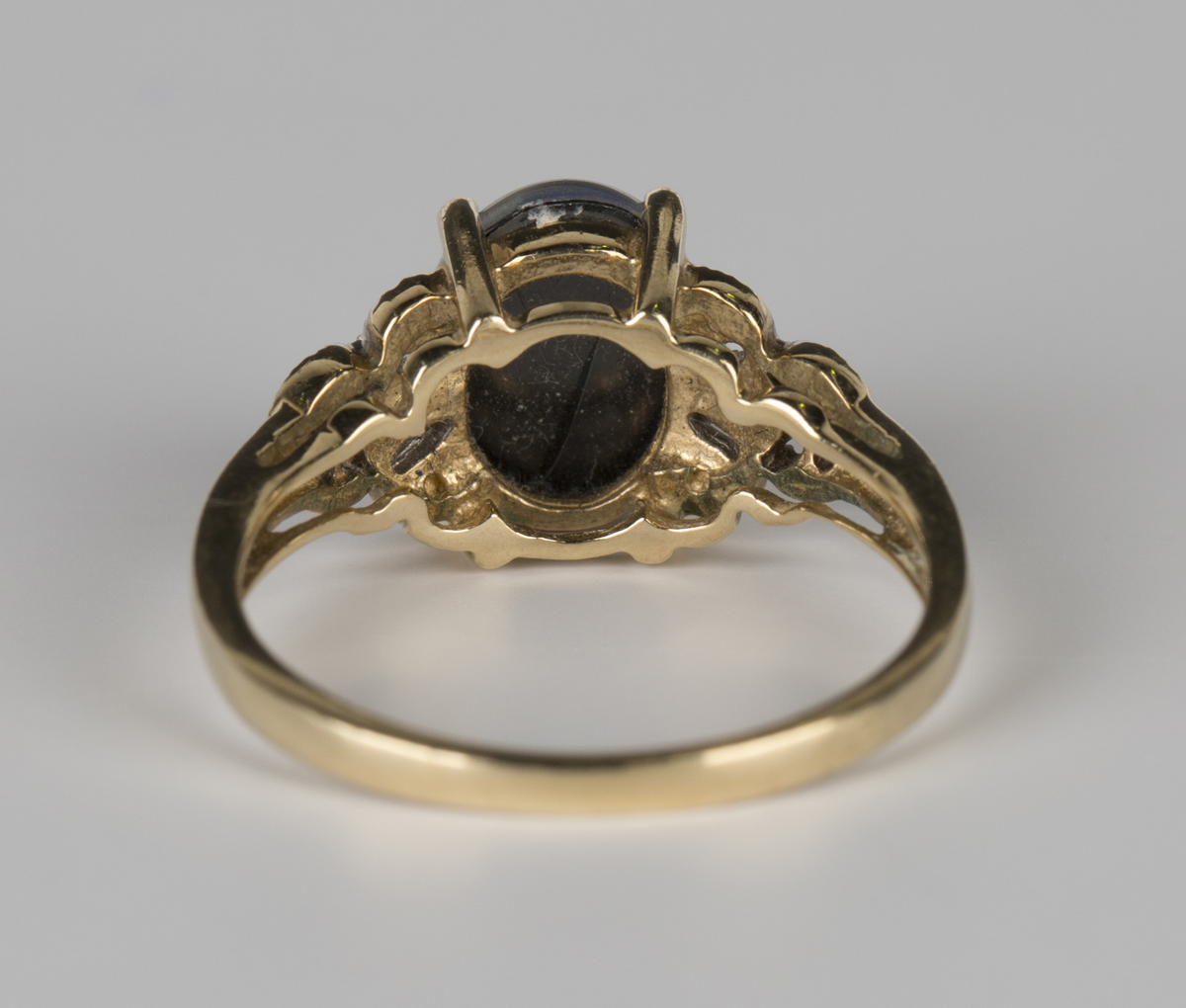 A 9ct gold ring, claw set with an oval opal triplet between diamond set pierced shoulders, - Image 3 of 6