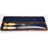 A Victorian ivory handled carving knife and fork, each handle carved with a bust portrait of a