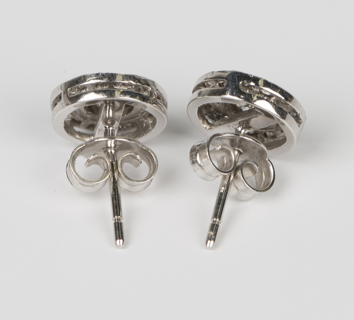 A pair of white gold and diamond earstuds, each collet set with the principal circular cut diamond - Image 2 of 2