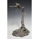 A Victorian plated desk stand, modelled as a monkey hanging from a tree with its left hand forming a