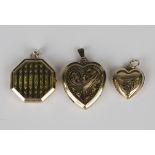 A gold back and front octagonal pendant locket with engine turned decoration, length 2.5cm, and