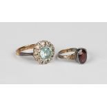 A gold, silver, blue zircon and colourless gem set cluster ring, detailed '9ct', ring size approx