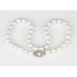 A single row necklace of cultured pearls on a snap clasp, length 46cm.Buyer’s Premium 29.4% (