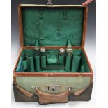 A George V leather and canvas travelling vanity case, bearing label inscribed 'Makers Bick Bros