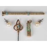 A Victorian gold cased and turquoise set slide action pencil with a foil backed yellow gem set