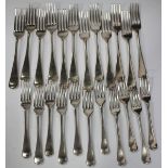 An Edwardian part canteen of silver Old English pattern cutlery, comprising twelve table forks and