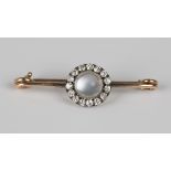 A gold and silver set moonstone and diamond cluster bar brooch, mounted with the circular cabochon