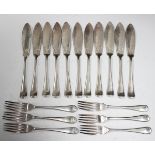 A set of eleven George V silver fish knives and six matching forks, Sheffield 1932 by Harrods Ltd.