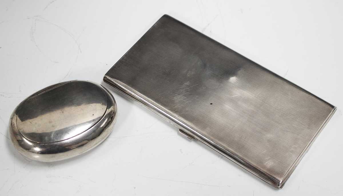 A late Victorian silver oval tobacco box with sprung hinged lid, London 1896, length 8.5cm, and a