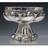 An Edwardian silver cup in the form of a font, the bowl of circular form with lobed body on a