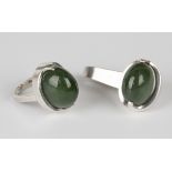 A Sven Haugaard silver mounted oval dyed green agate single stone pendant, detailed '925 S Denmark