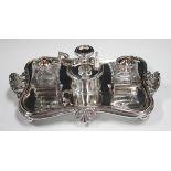 An early 19th century Sheffield plate inkstand, fitted with a pair of cut glass inkwells and covers,
