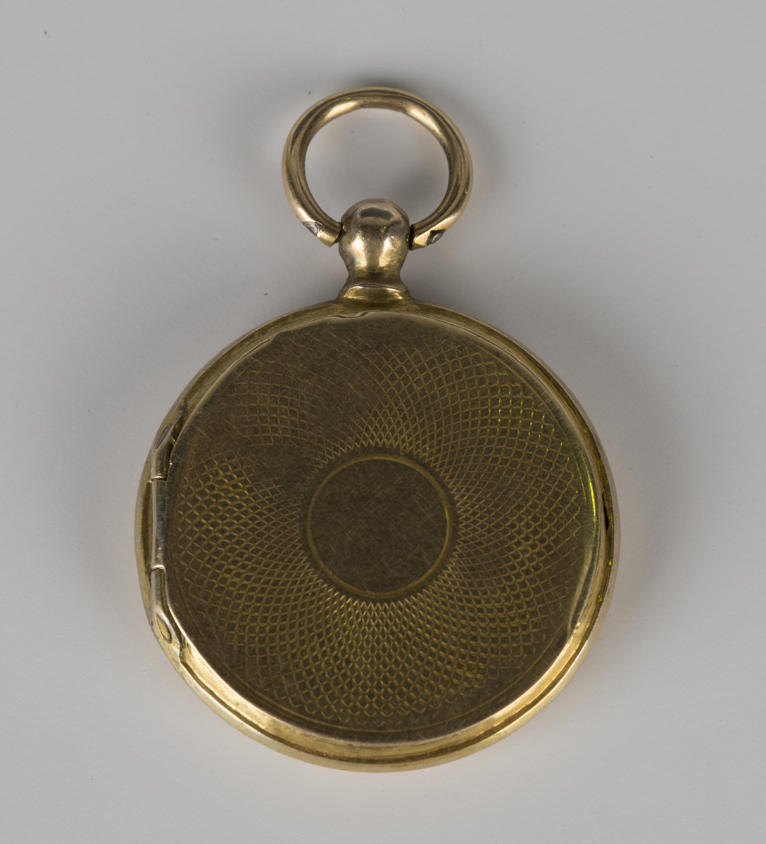 A Victorian blue enamelled circular pendant locket, the front with floral decoration on a cross- - Image 3 of 3