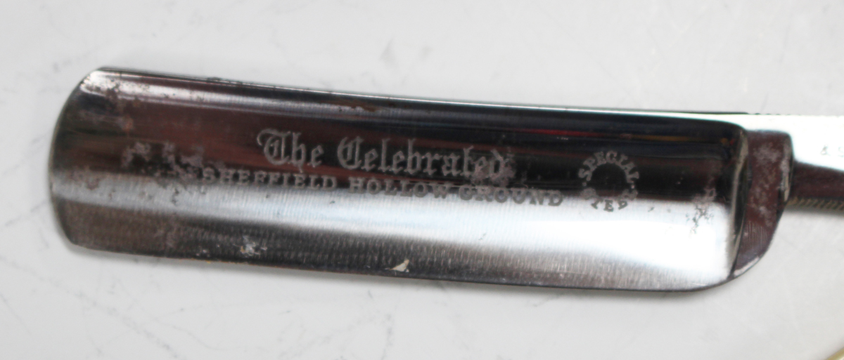 A George V silver rectangular cut-throat razor box with hinged lid, the interior fitted with seven