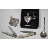 A modern silver heart shaped scent bottle and funnel, two silver bladed and mother-of-pearl