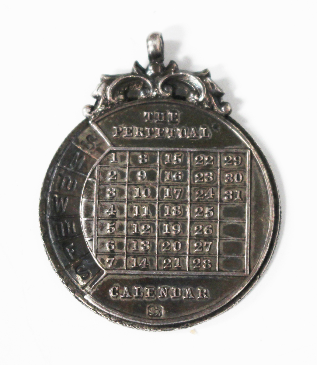 A late Victorian silver 'The Perpetual Calendar' pendant, Birmingham 1898 by F.W.P. & Co, stamped '