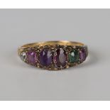 A Victorian 15ct gold and gem set 'Regard' ring, the mount decorated with engraved shoulders,
