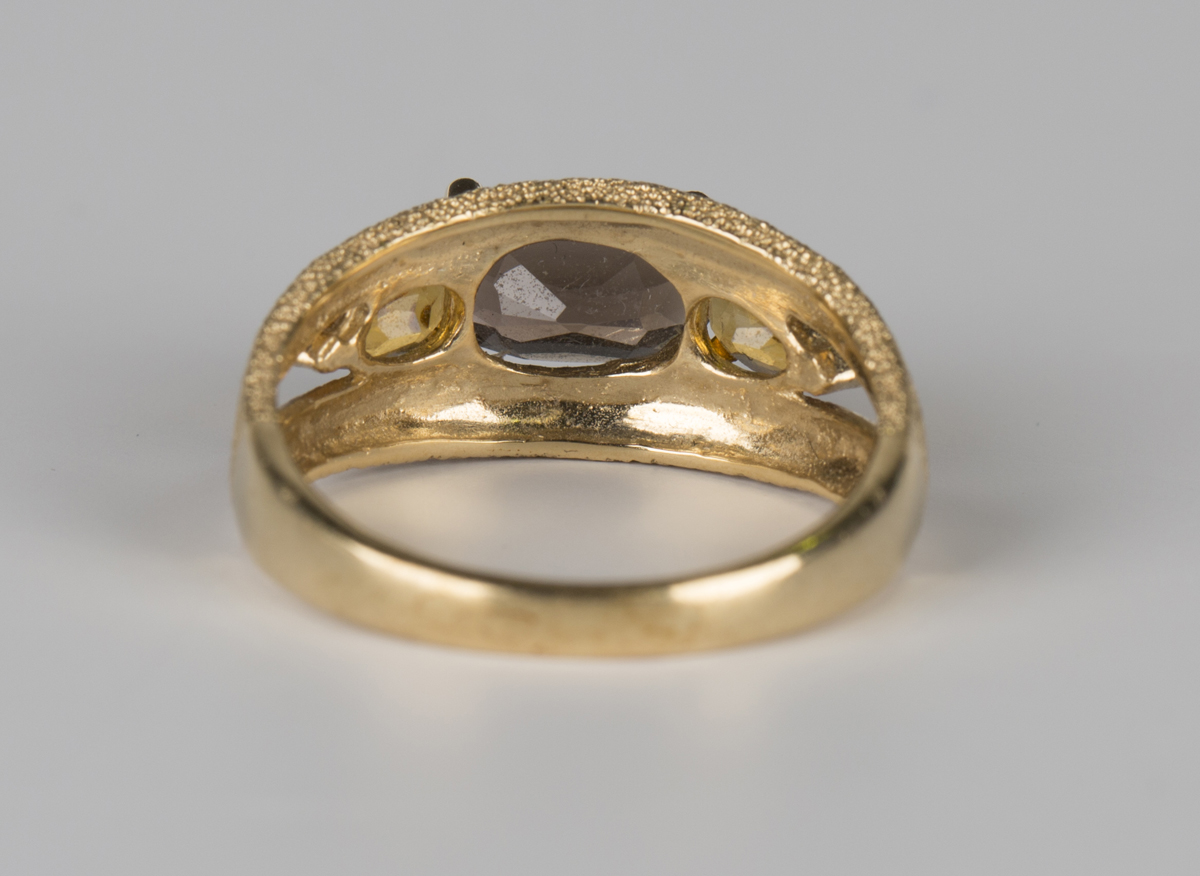 A 9ct gold ring, claw set with an oval cut smoky quartz between two pear shaped citrines, - Image 4 of 4