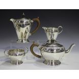 An Elizabeth II silver four-piece tea set, each piece decorated with a Celtic style band, comprising