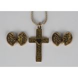 A 9ct gold pendant cross with floral and foliate decoration and a central heart motif, Birmingham