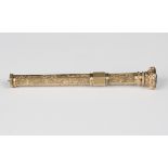 A Victorian gold cased hexagonal slide action pencil with floral engraved decoration and a