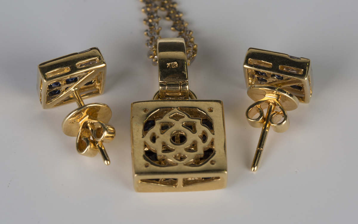 A gold, sapphire and diamond pendant of square form, mounted with sixteen square cut sapphires and a - Image 2 of 2