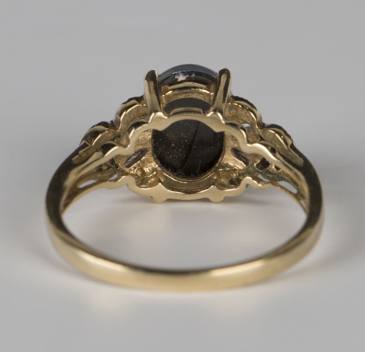 A 9ct gold ring, claw set with an oval opal triplet between diamond set pierced shoulders, - Image 6 of 6