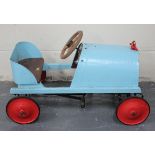 A child's vintage style pedal car, finished in turquoise with black chassis and red wheels, length