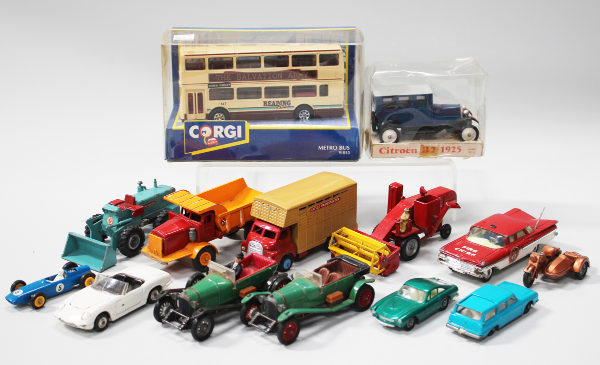 A small collection of diecast vehicles, including a Corgi No. 91850 Metro Bus, within a window