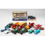 A small collection of diecast vehicles, including a Corgi No. 91850 Metro Bus, within a window