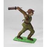 A 1920s/30s tinplate figure of a British First World War grenade throwing/bomb launching soldier,