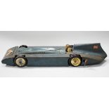 A Betal tinplate clockwork Bluebird land speed car with driver and facsimile Malcolm Campbell