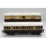 A Märklin for Gamages gauge O 1st/3rd LNWR bogie coach 1153, a luggage/brake van 1436, a railway