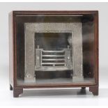 A George III polished steel doll's house fireplace, the surround with engraved foliate scrolls, 16cm