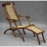 A late Victorian walnut framed folding steamer armchair with caned panels, height 90cm, width 55cm.