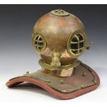 A 20th century copper and brass mounted replica model of a diver's helmet, height 43cm, width 44cm.